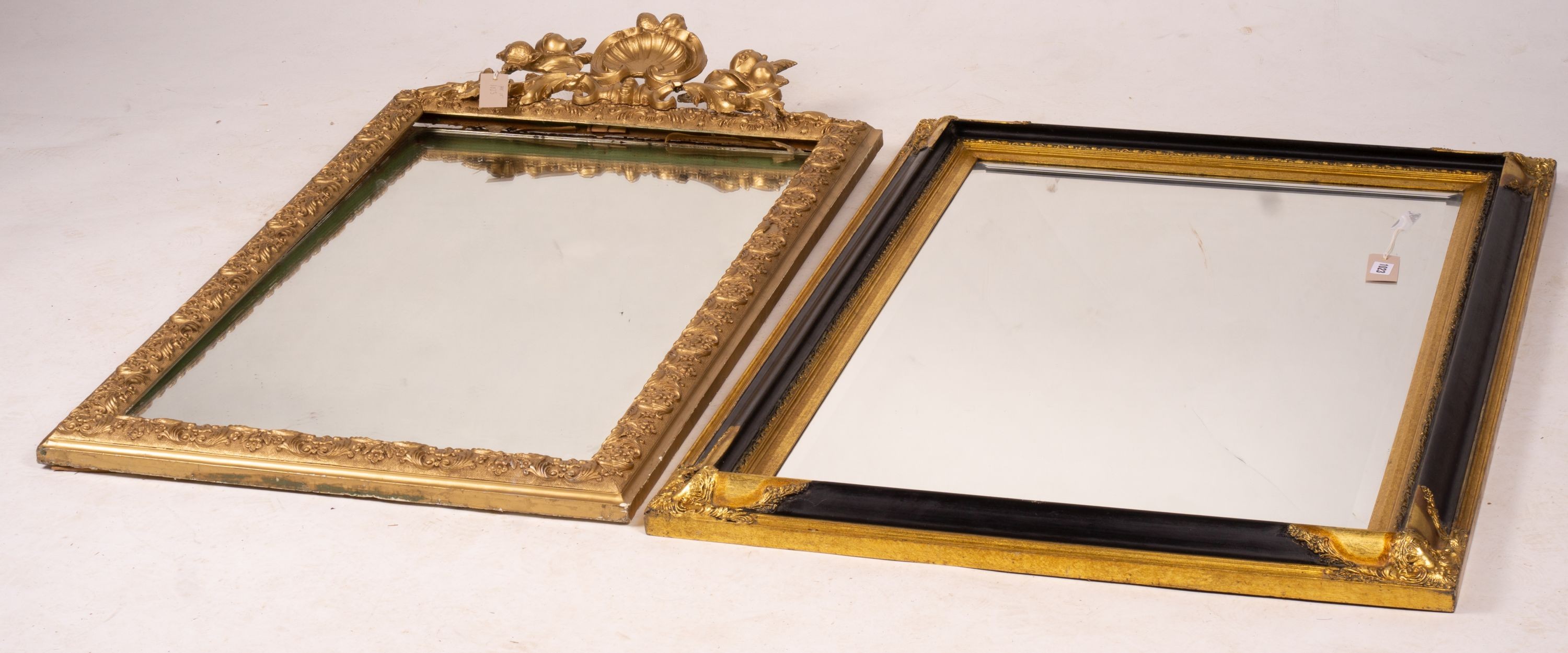 A 19th century French gilt gesso wall mirror, width 64cm, height 116cm together with a modern larger rectangular wall mirror